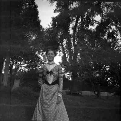 Grace Parker in blue silk dress