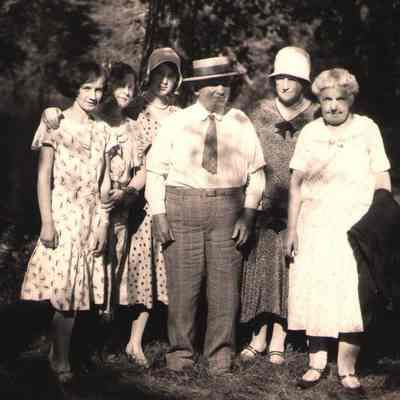 City Park, Hillsboro, ND: Stina (Halvorson) Hovet (at right) with Martin and Sarah Leet and likely their daughters Luella and Hazel. The third young women, between Luella and Hazel, is probably one of Matt and Nettie Halvorson's daughters. For example, Mildred Halvorson was close to the age of Hazel Leet. [written on the back: "Martin & Mrs. Leet"]