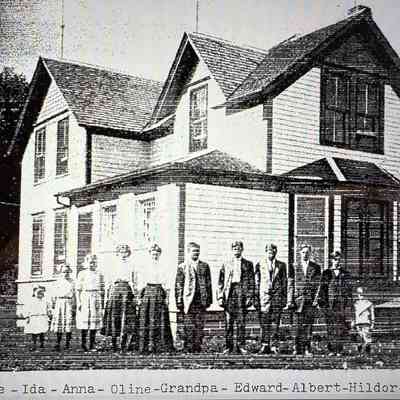 The Kamphaug Family: Inger & Olaus, a document written by a granddaughter and contributed to the TCHS in Hillsboro, ND, by a descendant, Graeme Matichuk: Family photo, page 16: Olaus Kamphaug with his ten surviving children, taken about 1910 at the home farm