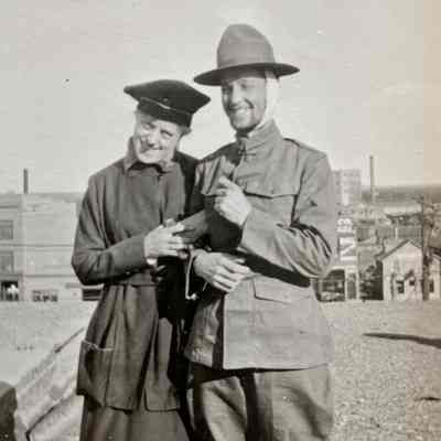 Woman and Man in Military Uniform: a photo from Nelmer Talmo, bicycle repair shop operator in Hillsboro in the early 1900s