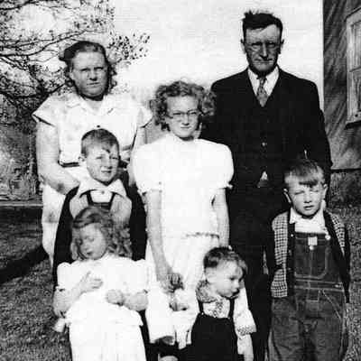 Photo courtesy Ancestry.com Ackerman/Kneip/Fleischer/Hagen Family Tree by Jackie Ausk: Delores Ackerman standing between her parents and with younger siblings