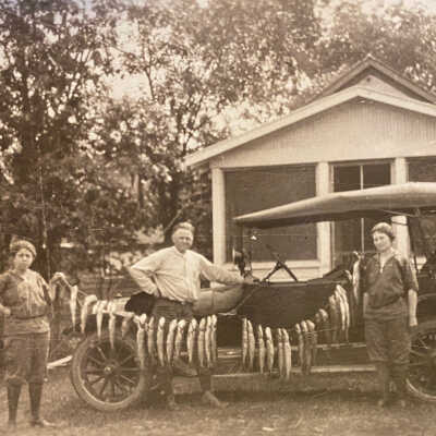 String of Fish by a Model T