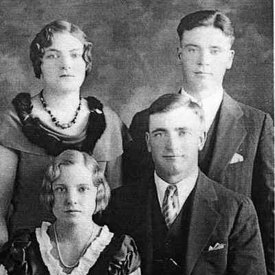 Photo courtesy Ancestry.com Ackerman/Kneip/Fleischer/Hagen Family Tree by Jackie Ausk: Photo of George V. Jr and Agnes (Kneip) Ackerman with Gertrude Kneip and Ferdinand Ackerman standing at back
