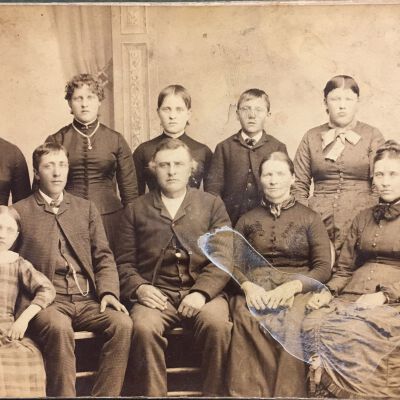 Knud & Mari Swenson with 9 of their 10 children: back, l-r, Maren, Bertha, Annie, Elling, Ingeborg, Andrew; front, l-r, Carrie, Hans, Knud, Mari, Liva (not picture, Svend, or Swen).