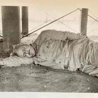 Jerome Baglien napping under mess hall - 1941