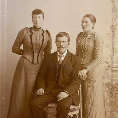Man and two women, taken Skrivseth Studio, Hillsboro, ND