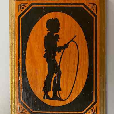 Wooden Plaque of Boy Holding a Rope