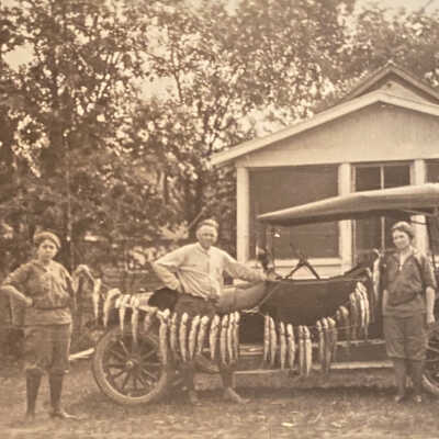 Two Women & a Man with a String of Fish