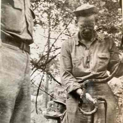 Soldier (Snakes Johnson) holding a snake