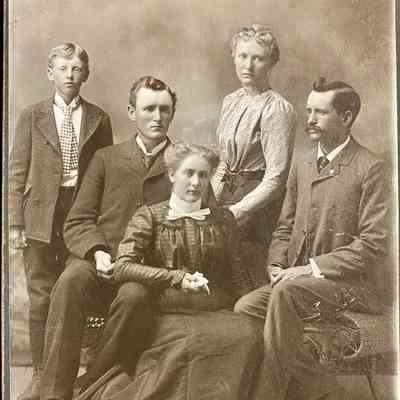 Four adult children of Knud & Anne Figenskau, l-r: Thomas, Clara, Tina and Jens, and perhaps a grandson (unknown) at left.: A. P. Holand Studio, Grand Forks, ND