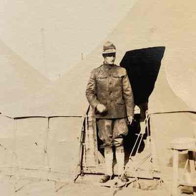 Soldier by Tent: a photo from Nelmer Talmo, bicycle repair shop operator in Hillsboro in the early 1900s