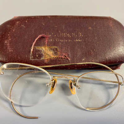 Glasses with Dr. Little, M.D. Case used by Olga (Mrs. Martin) Johnson