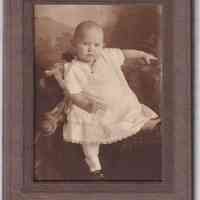 Portrait of Infant “Rachel Kaiser” Reclining on Fur Studio Prop