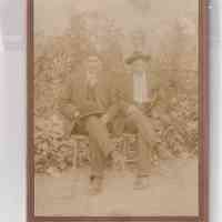 Two Seated Gentlemen in Outdoor Setting