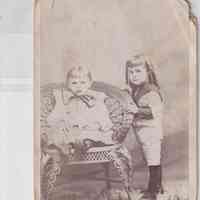 Sibling Portrait of Young Boy and Girl with Wicker Studio Chair