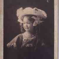 Portrait of Young Girl Wearing Oversized Decorative Hat