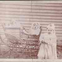 Children with Wicker Baby Carriage — Outdoor Domestic Portrait