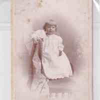 Toddler in Light Dress Leaning on Draped Studio Prop — W.H. Judkins Portrait