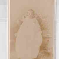 Infant in Long Christening Gown on Ornate Settee — Lothrop & Cunningham Studio Portrait