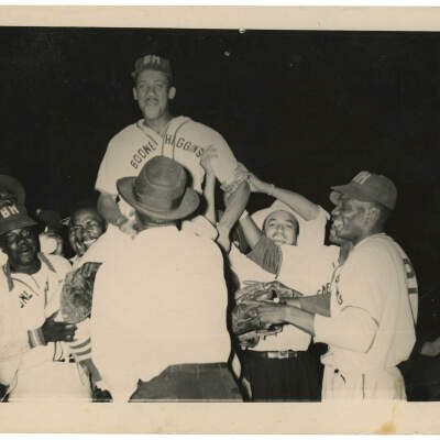 2022.024.006 Recto: Black and white photograph of a team celebration for the Boone Higgins Baseball team