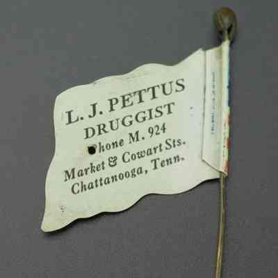 2023.022.001: Celluloid advertising stickpin