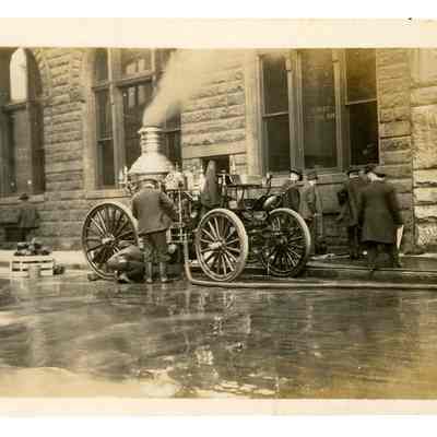 2022.057.017: Black and white photograph of a Chattanooga Fire Department Engine following a fire at First National Bank
