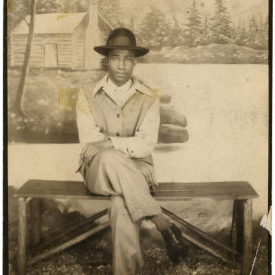 Man in Front of Cabin Backdrop
