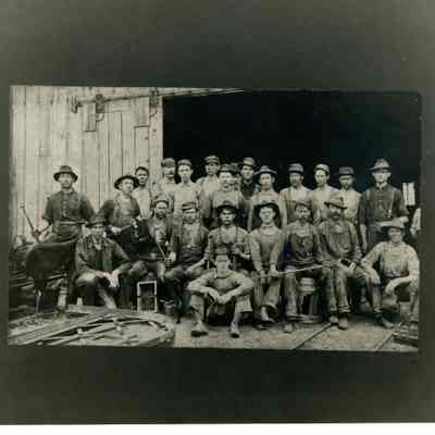 2022.057.011: Black and white photograph of workers in 1899