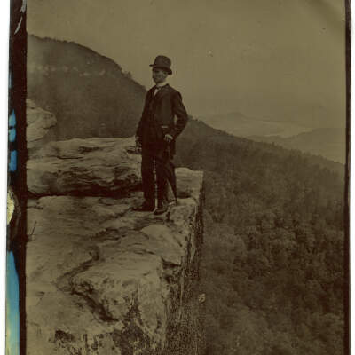 Man Standing at Sunset Rock