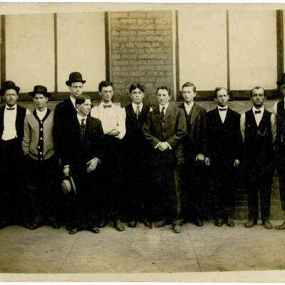 2020.452.002: Chattanooga Steam Laundry group photo with Judd Ledford at center with his hand folded.