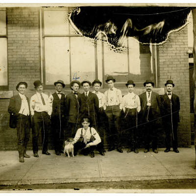 2020.452.003: Chattanooga Steam Laundry staff photo with small white dog.