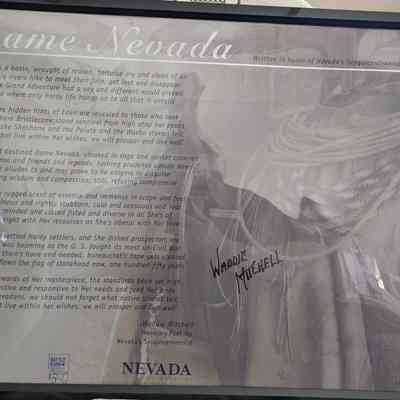 two signed and framed posters from Nevada's sesquicentennial.