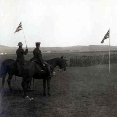 Photo of soldiers in formation and on horseback