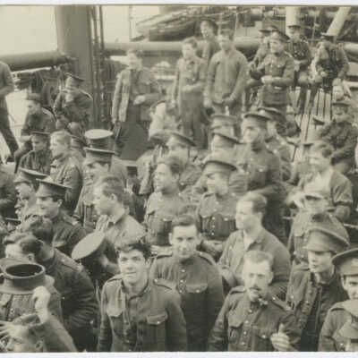 Men standing aboard a ship