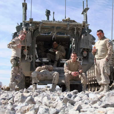 Canadian Troops Relaxing Outside their Vehicles