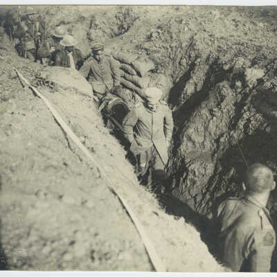 Wounded in Trench Carried by POW