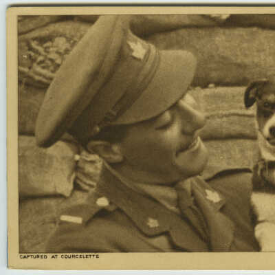 Soldier Holding a Dog