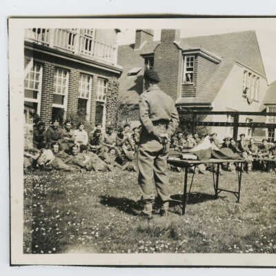 Captain Harold A. McBride Telling a Tale to his Men