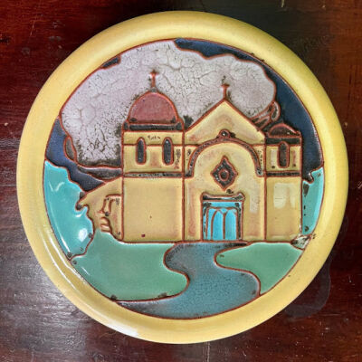 Circular glazed California Faience table tile depicting Carmel Mission, c. 1930s