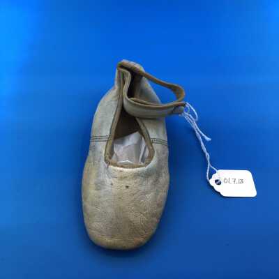 White leather baby shoe worn by Charles Paxton Davis, c. 1902
