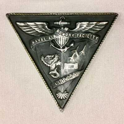 Decorative plaque from the Naval Air Rework Facility at NAS, c. 1990s