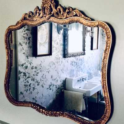 Framed mirror with cast gesso frame from the Anderson family, c. 1930s