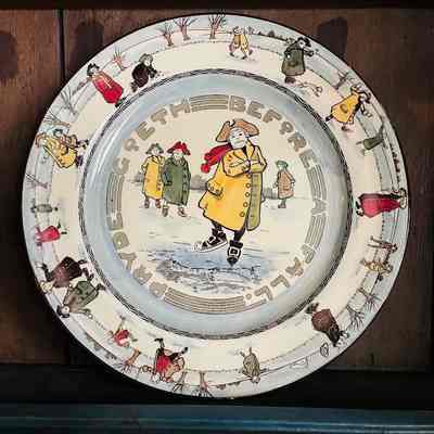 Royal Daulton plate with design of skating people, early 1900s