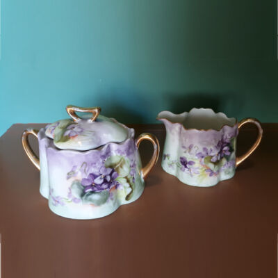 Stephans Porcelain sugar and creamer set with lavender violets and gold accents, c. 1920s