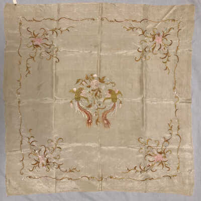 Ecru table scarf with green, blue, and pink machine embroidery of birds and flowers, c. 1900