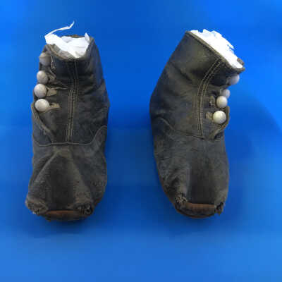 Child's black leather high button shoes with glass buttons, late 1890s
