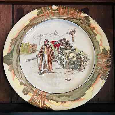 Royal Daulton plate with design of early automobiles, early 1900s