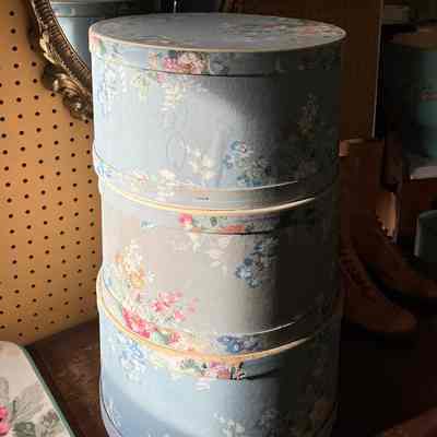 Series of hat boxes covered in floral wallpaper, of Lillian Nielsen, c. 1950