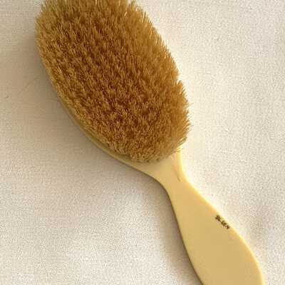 Celluloid hair brush of Marie Anderson Camp, c. 1920s