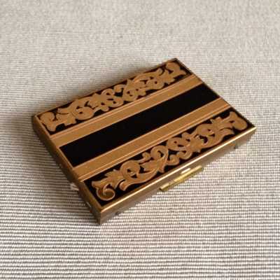 Rectangular Black and brass compact of the Martin family, c. 1940